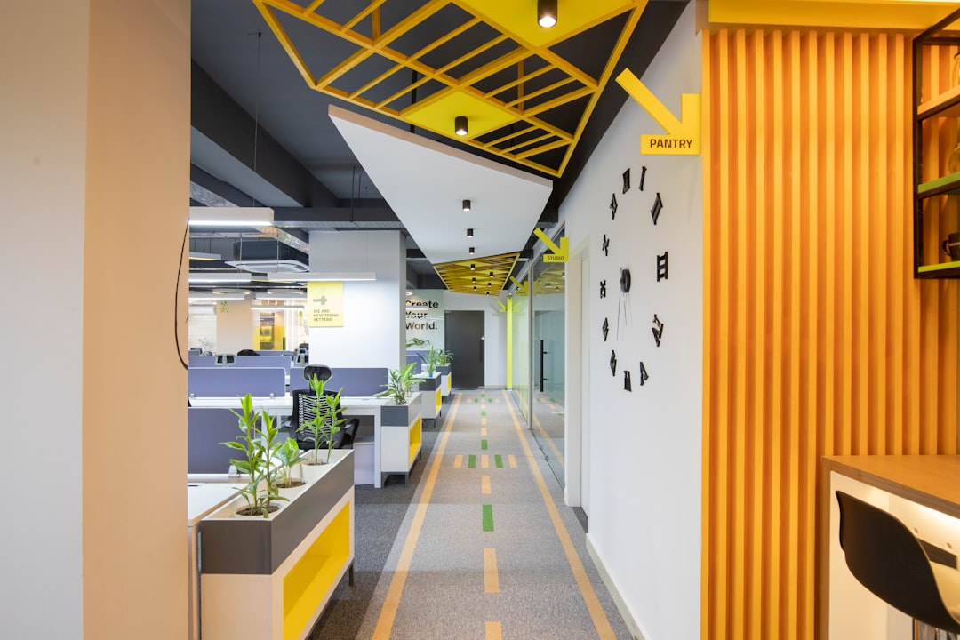 a-long-hallway-with-yellow-and-black-accents-lan0qkzcrpc